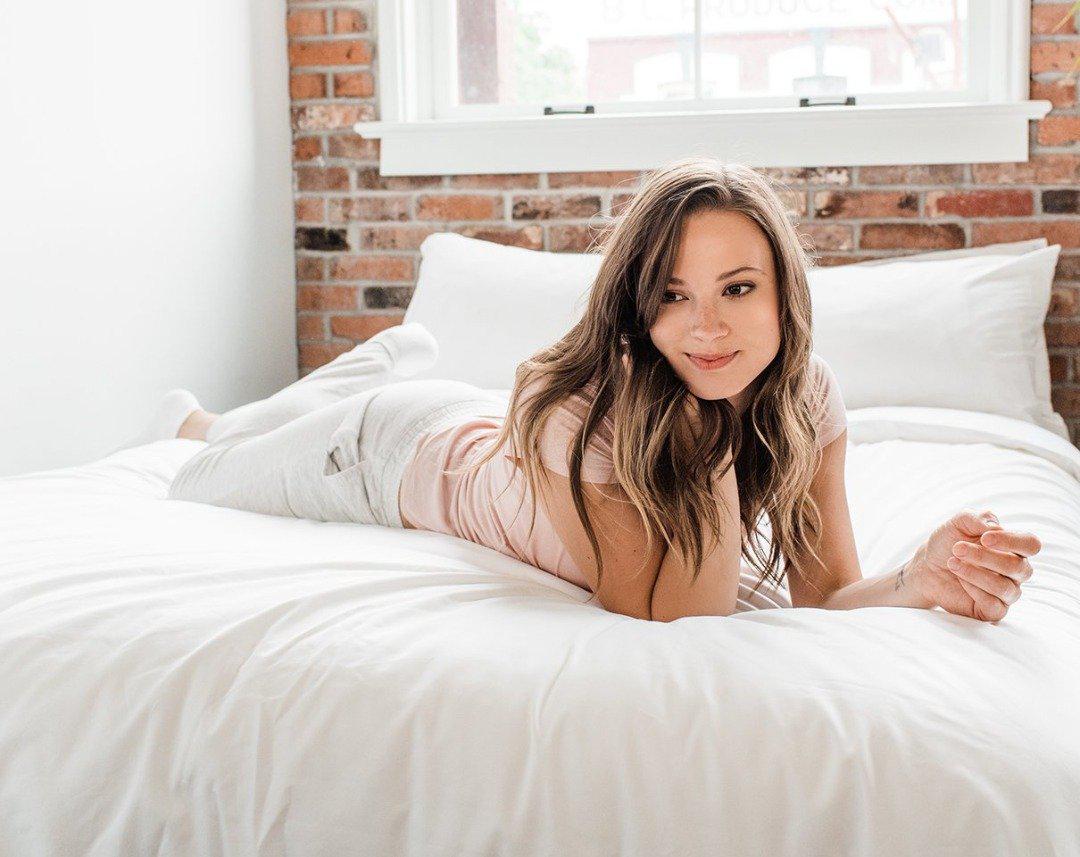 brunette woman on bedface premium duvet cover